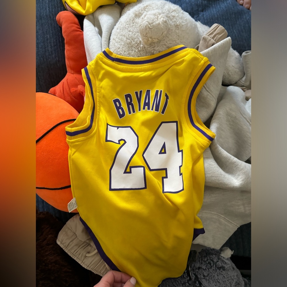 Lakers jersey onesies for kids (2 of them in different sizes)